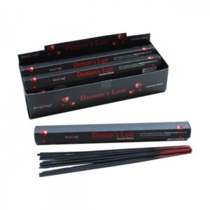 Demon's Lust Incense Sticks in a decorative holder with smoke rising.