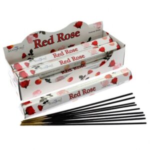 Red Rose Premium Incense sticks in a stylish holder, creating a calming atmosphere.