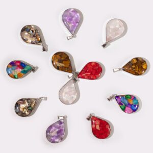 Assorted gemstone chips and shells in a steel cased pendant teardrop design.