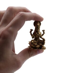 Handcrafted brass statue of Goddess Laxmi with intricate detailing.
