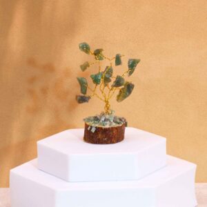 Mini gemstone tree with green aventurine stones on a wooden base.