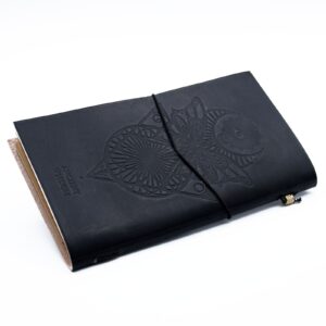 Handmade black leather journal with embossed design and wrap-around band.