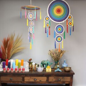 Vivid rainbow dreamcatcher inspired by Balinese temple umbrellas.