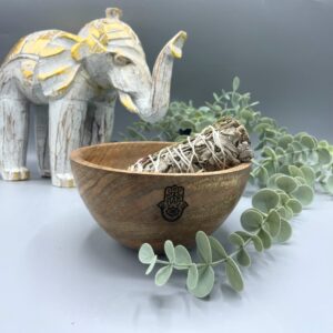 Wooden smudge bowl with Hamsa design, perfect for rituals and offerings.