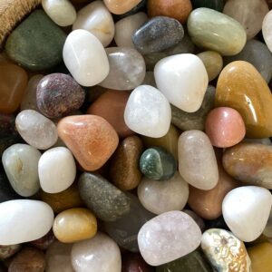 Colourful mixed gemstones in a 1kg bag, ideal for crafts and decorative use.