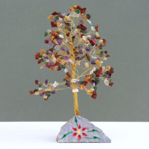 Handmade Indian gemstone tree with vibrant stones on a rock base.