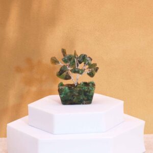 Mini gemstone tree with green aventurine stones on an orgonite base.