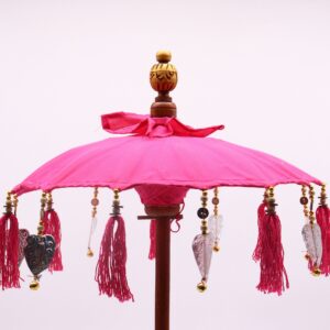Handcrafted pink Bali home decor parasol adding elegance to any space.