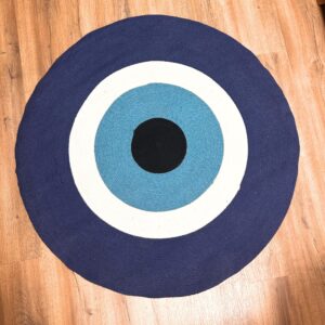 Cotton rope rug featuring a bold blue Evil Eye motif for home decor.