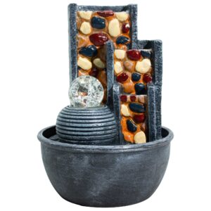 Pebble wall tabletop water feature with a crystal ball centerpiece.