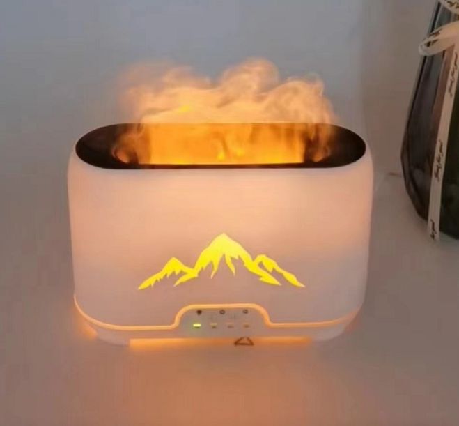 Himalayas Aroma Diffuser with flame effect and remote control in a serene setting.