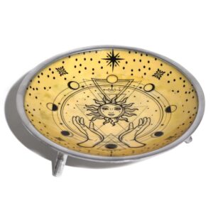Enamelled offering plate with hands and sun design in warm golden tones.