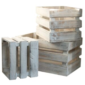Set of three whitewashed wooden storage crates for home organisation.