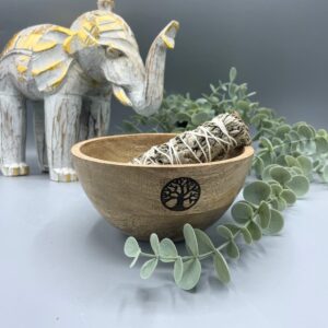 Wooden smudge bowl with Tree of Life design, ideal for rituals and offerings.