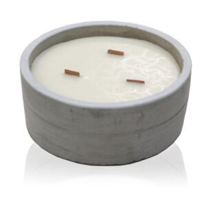 Large round concrete candle with wooden wick, featuring crushed vanilla and orange scent.