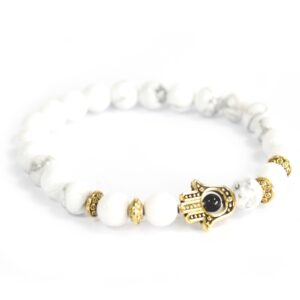 Gold Hamsa bracelet with white Howlite stones and mixed metal accents.