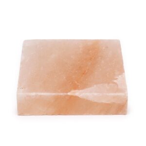 Square Himalayan salt cooking plate for grilling and serving food.