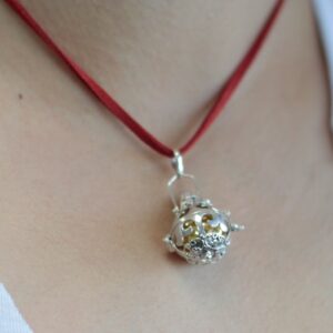 Artisan silver angel bell from Bali, symbolising grace and love.