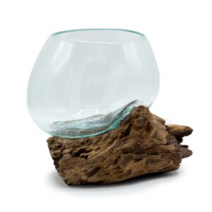 Handmade molten glass bowl on wood, showcasing natural elegance and craftsmanship.