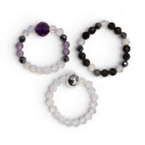 Nymph Spirit gemstone ring set featuring soft light and deep night tones.