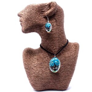 Teal jewellery set featuring real pressed flowers in glass pendants.