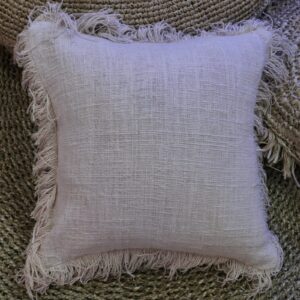 Linen cushion cover with fringe, perfect for adding style to your home decor.