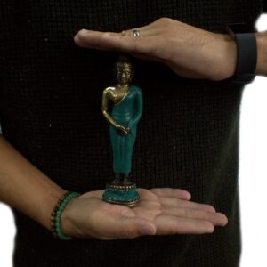 Brass Standing Buddha ornament for home decor and meditation spaces.