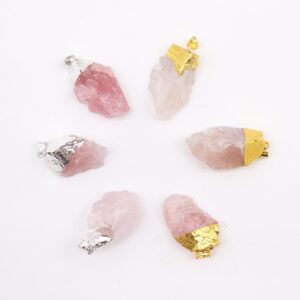 Assorted rose quartz pendants with gold and silver plating displayed elegantly.