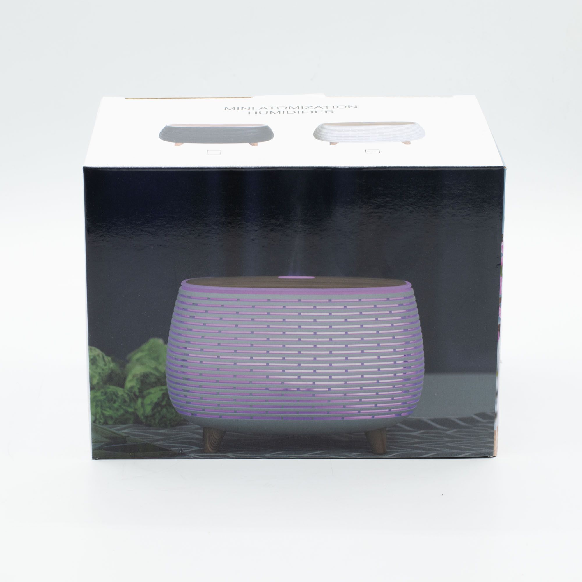 Futuristic ribbed aroma diffuser with wood-effect top and colour-changing light.