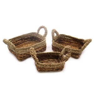 Set of three square baskets made from banana leaf and seagrass.