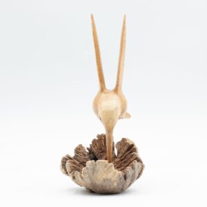 Handmade wood carving of a hummingbird mid-hover, showcasing intricate details.