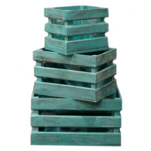 Set of three greenwashed wooden storage crates for home organisation.
