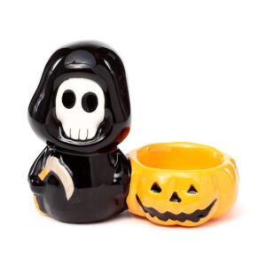 Ceramic skull boy tea light candle holder with a mischievous grin.