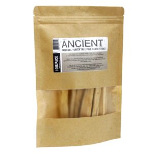 Bundle of 10-15 Green Tree Palo Santo sticks on a wooden surface