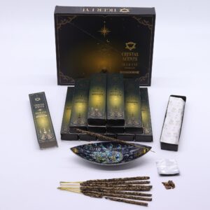 Vanilla smudge incense sticks with tiger eye chipstones in a serene setting.