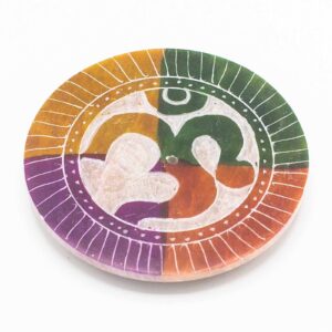 Soapstone disc incense holder featuring the sacred 'Om' symbol for serene spaces.