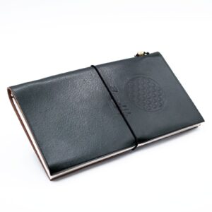 Handmade leather journal featuring a green Flower of Life design with embossed details.