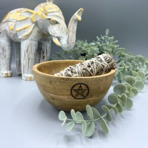 Wooden smudge bowl featuring a pentagram design, perfect for rituals and offerings.