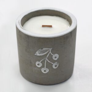 Wooden Wick Concrete Candle in Juniper & Sweet Gin scent, showcasing its unique design.
