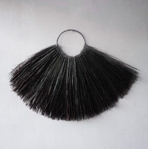 Large black seagrass fan wall decor showcasing bohemian style and craftsmanship.