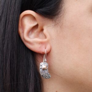 Elegant silver and gold angel wings earrings with a hook fitting.