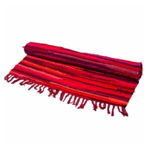Vibrant large rag rug in shocking pinks, perfect for home decor.