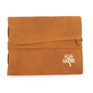 Elegant leather sketchbook featuring a golden tree design on the cover.