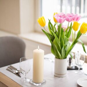 Ivory pillar candle with a smooth finish, perfect for creating a calming atmosphere.