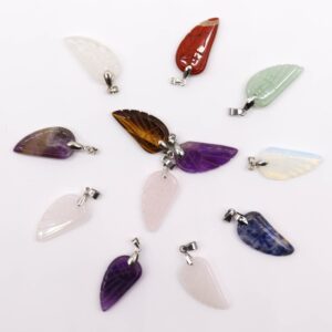 Assorted gemstone angel wings pendants in various colours and designs.