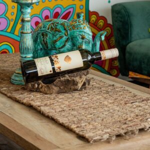 Handcrafted water hyacinth table runner with fringe detail in natural Robusta tone.