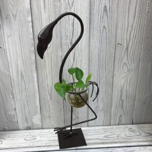 Tall flamingo pot stand for hydroponic home decor with small plants.