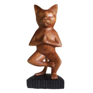 Handcarved wooden yoga cat sculpture in a one-legged pose.