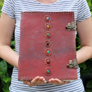 Large leather book featuring 7 chakra symbols, perfect for journaling.