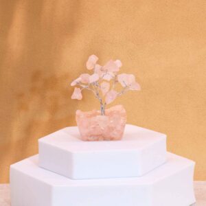 Mini gemstone tree made of rose quartz on an orgonite base with 15 stones.